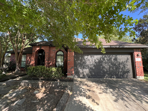 newly-painted-house-suburbs A mixed brick home with a newly painted garage door
