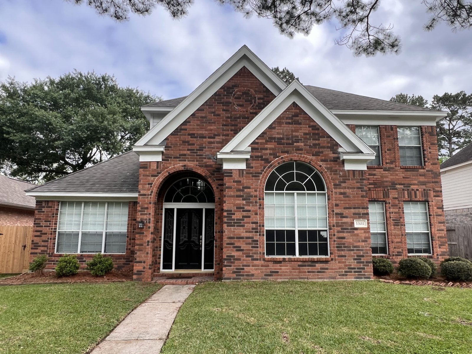 Front exterior of a mixed brick home in Houston