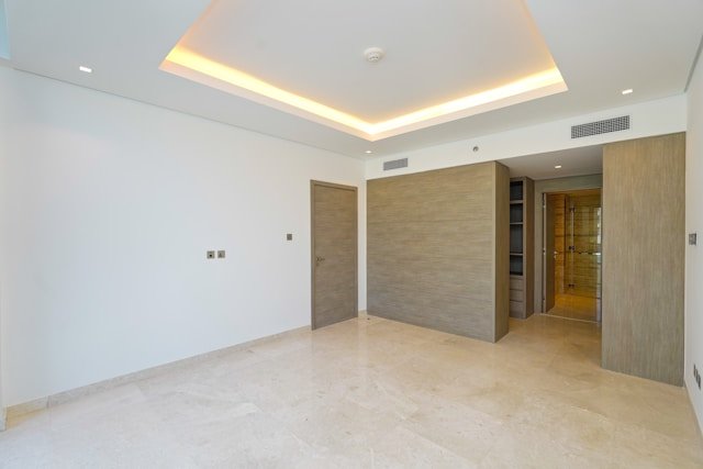 Modern empty room with light beige concrete flooring