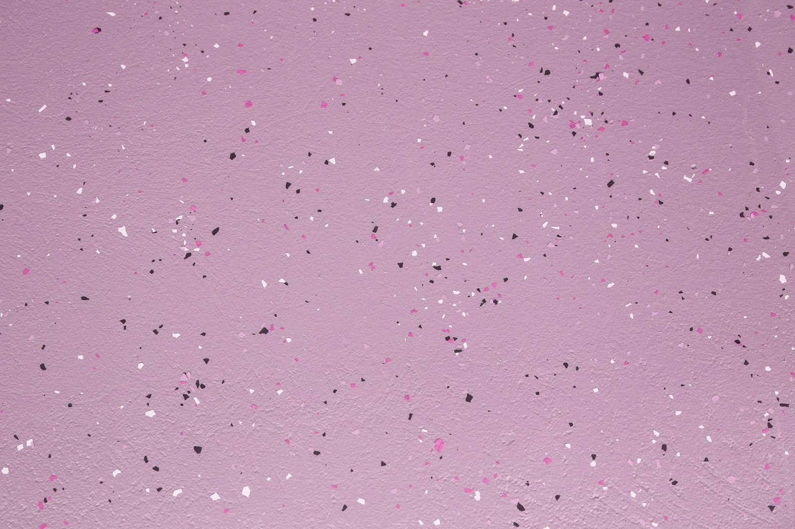 A decorative pink epoxy floor with flakes