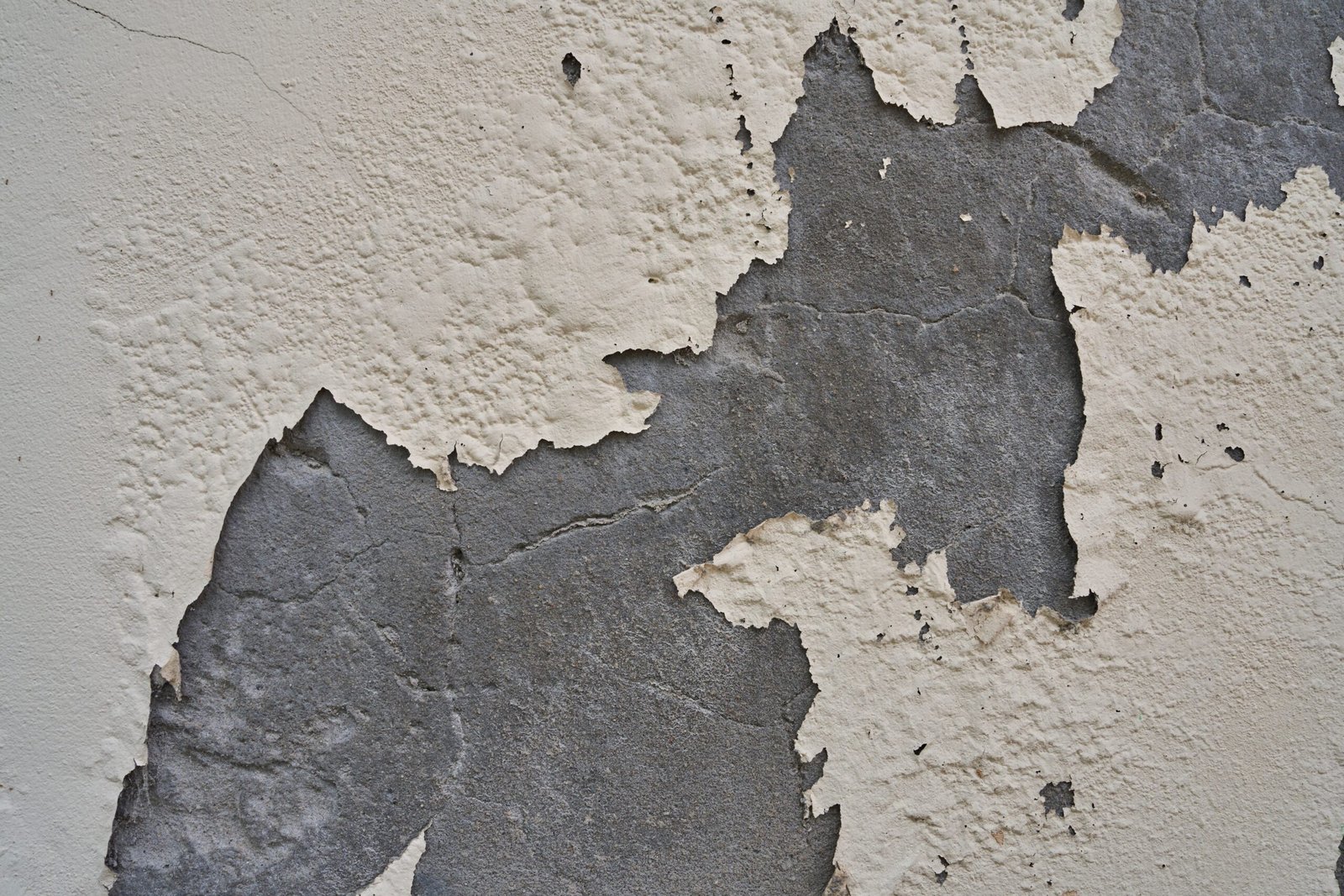 Weathered,Wall,Showing,Layers,Of,Peeling,Paint,And,Textured,Concrete.