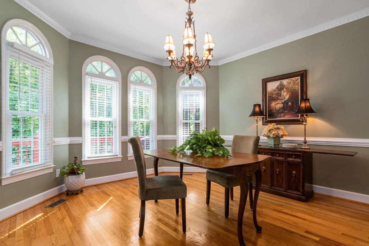 crown-molding-dining-room-houston Dining room featuring white crown molding and chair rail trim