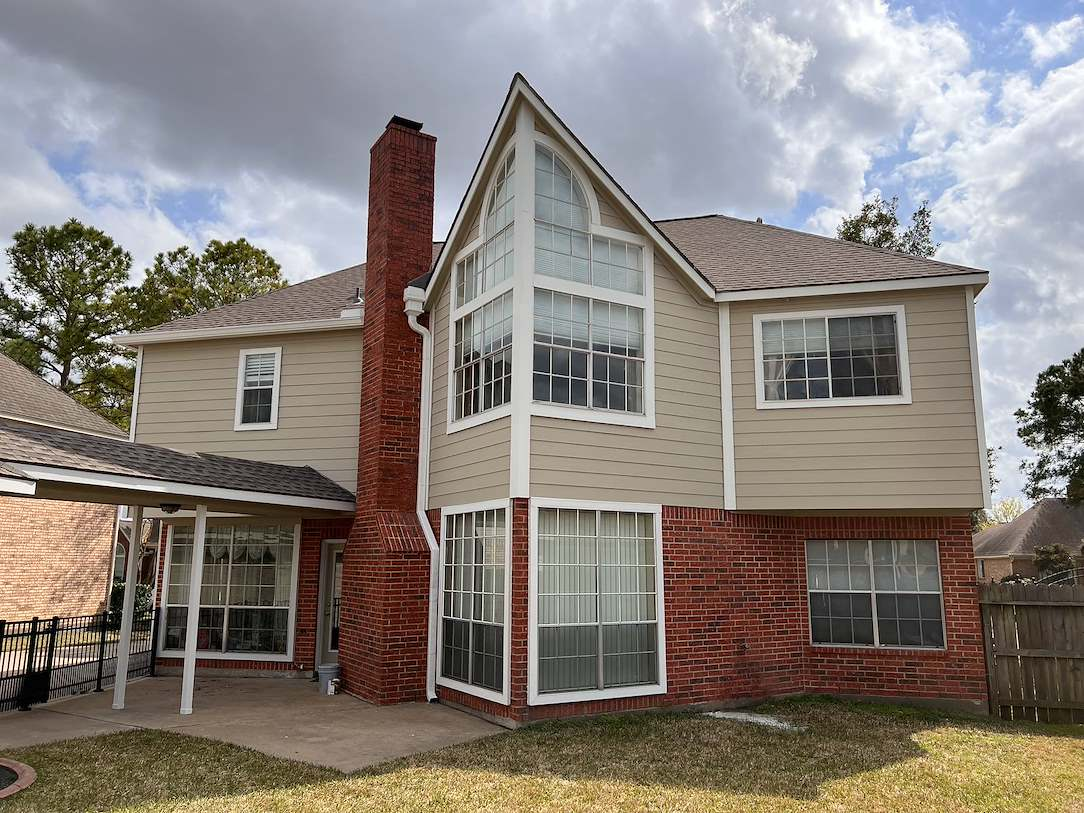 home-painters-fulshear A freshly painted multi-floor brick and siding home in Houston